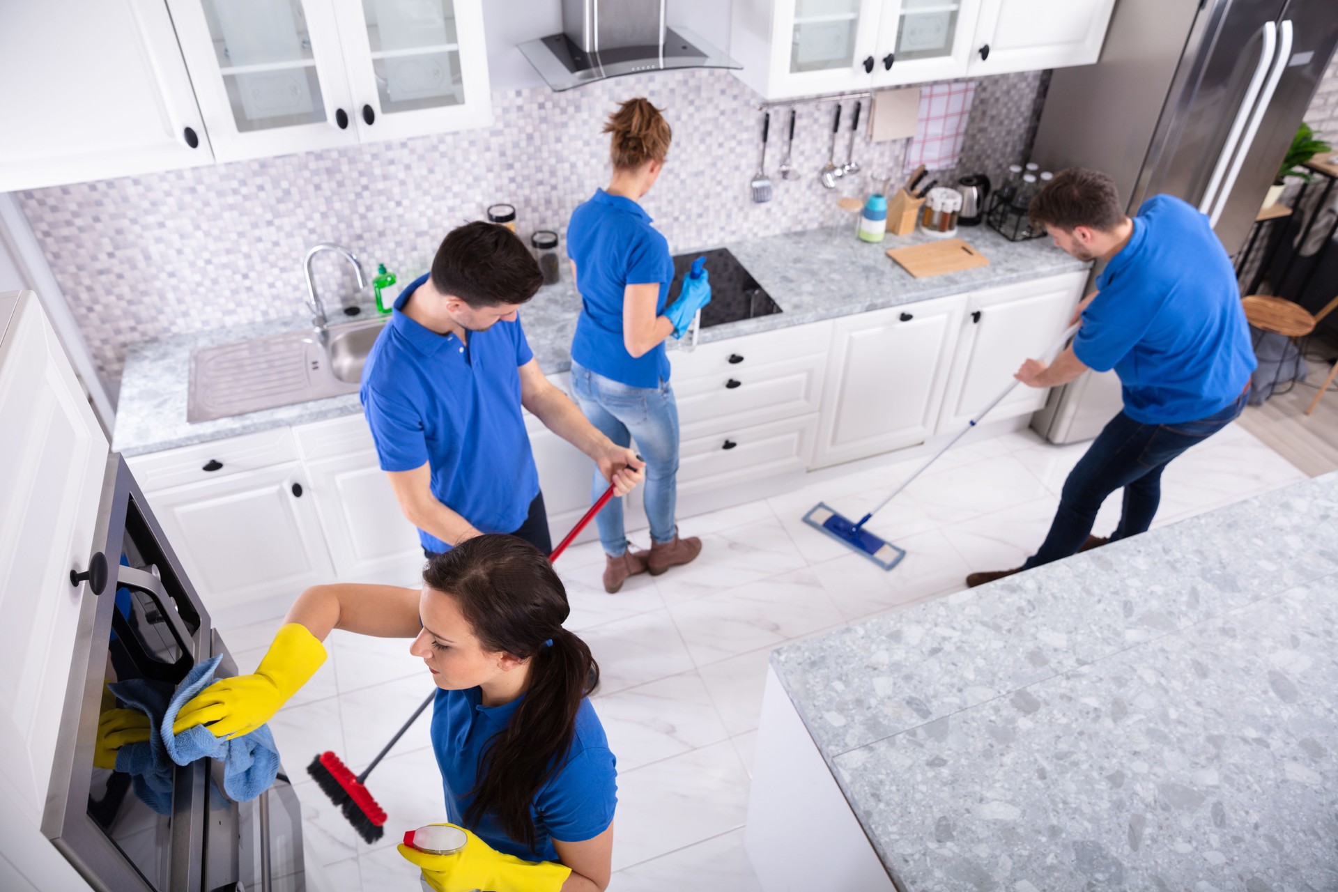 Janitors Cleaning Kitchen